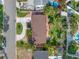 An aerial shot of the property showcasing the house, driveway, manicured yard, and pool at 3843 Neptune Se Dr, St Petersburg, FL 33705