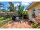 Patio with grill and lush landscaping at 3843 Neptune Se Dr, St Petersburg, FL 33705