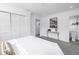 Bright bedroom featuring soft carpet, closet, and neutral paint at 3843 Neptune Se Dr, St Petersburg, FL 33705