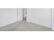 Bright bedroom featuring clean white walls, plush carpet, and spacious closet storage at 3843 Neptune Se Dr, St Petersburg, FL 33705