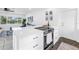 Stylish kitchen island with cooktop and ample counter space perfect for entertaining at 3843 Neptune Se Dr, St Petersburg, FL 33705