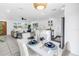 Open-concept living space with dining area and kitchen view, great for modern living at 3843 Neptune Se Dr, St Petersburg, FL 33705