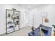Bright office space with shelving unit, desk, and neutral carpet flooring at 3843 Neptune Se Dr, St Petersburg, FL 33705