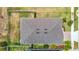 An overhead aerial view of a home with a fenced in backyard, a covered patio and lush surrounding landscaping at 3891 Reflection Dock Dr, Seffner, FL 33584