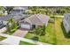 From above, the home features a neatly kept yard near other residences, with a pond adding to the peaceful setting at 3891 Reflection Dock Dr, Seffner, FL 33584