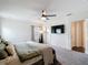 Bright bedroom boasts a ceiling fan, plush carpet, and recessed lighting at 3891 Reflection Dock Dr, Seffner, FL 33584