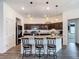 Open kitchen featuring a granite island with seating and modern appliances for cooking at 3891 Reflection Dock Dr, Seffner, FL 33584