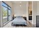 Bright bedroom with ensuite bathroom, large window, and modern style at 4047 Gauge Line Loop, Tampa, FL 33624