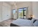 Serene bedroom with a large window, ambient lighting, and spacious closet at 4047 Gauge Line Loop, Tampa, FL 33624