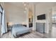 Comfortable bedroom with sleek decor, large windows, and an ensuite bathroom at 4047 Gauge Line Loop, Tampa, FL 33624