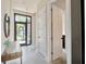 Inviting entryway with stylish finishes, natural light, and modern doors at 4047 Gauge Line Loop, Tampa, FL 33624