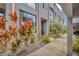 Modern townhome with lush tropical landscaping and a sleek gray exterior at 4047 Gauge Line Loop, Tampa, FL 33624