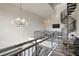 Bright hallway featuring a modern railing and spiral staircase at 4047 Gauge Line Loop, Tampa, FL 33624