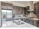Beautiful kitchen featuring stainless appliances, sleek countertops, and modern cabinetry at 4047 Gauge Line Loop, Tampa, FL 33624