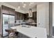 Contemporary kitchen with stainless steel appliances, island seating, and modern lighting at 4047 Gauge Line Loop, Tampa, FL 33624