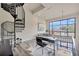 Second story office and loft area with an open floor plan, modern design, and spiral staircase at 4047 Gauge Line Loop, Tampa, FL 33624