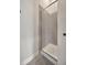 Sleek glass enclosed shower stall with gray tile surround and modern fixtures at 4047 Gauge Line Loop, Tampa, FL 33624