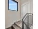 Staircase features modern railing, a large window, and natural light at 4047 Gauge Line Loop, Tampa, FL 33624