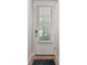 Back door is white with a window and lock. There is a blue door mat at 412 S Albany Ave # 2, Tampa, FL 33606