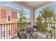 Relaxing balcony space with seating and views of the surrounding neighborhood and lush palm trees, perfect for outdoor enjoyment at 412 S Albany Ave # 2, Tampa, FL 33606