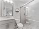 Updated bathroom featuring a sleek vanity with a gray countertop and a tiled shower/tub combo at 412 S Albany Ave # 2, Tampa, FL 33606