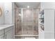 Modern bathroom showcasing a frameless glass shower with tiled walls and a built-in niche, offering a spa-like experience at 412 S Albany Ave # 2, Tampa, FL 33606
