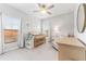 Cozy bedroom featuring a crib, a comfortable chair, and ample natural light, creating a warm and inviting Bedroom space at 412 S Albany Ave # 2, Tampa, FL 33606