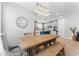 The dining area features a wooden table, modern chandelier, and access to the kitchen at 412 S Albany Ave # 2, Tampa, FL 33606