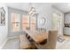 Dining room with light wood table and seating adjacent to the bright windows at 412 S Albany Ave # 2, Tampa, FL 33606