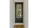 The front door is black with a window and decorative wreath at 412 S Albany Ave # 2, Tampa, FL 33606