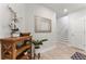 Hallway with decorative mirror, wooden shelves, staircase, and light wood floors at 412 S Albany Ave # 2, Tampa, FL 33606