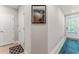 Hallway with light wood floors and 2 doors. There is a picture hanging on the wall at 412 S Albany Ave # 2, Tampa, FL 33606