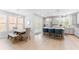 Eat-in kitchen with stainless appliances, marble countertops, and light wood floors at 412 S Albany Ave # 2, Tampa, FL 33606