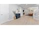 Open-concept living room with light floors, a blue accent rug, and decorative furnishings at 412 S Albany Ave # 2, Tampa, FL 33606
