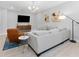Comfortable living room with modern decor, featuring soft seating and light-colored wood floors at 412 S Albany Ave # 2, Tampa, FL 33606