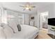 Inviting main bedroom with a ceiling fan, natural light, and an en-suite bathroom, designed for ultimate comfort and relaxation at 412 S Albany Ave # 2, Tampa, FL 33606