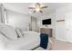 Spacious main bedroom featuring a ceiling fan, warm lighting, and ample closet space for a comfortable living experience at 412 S Albany Ave # 2, Tampa, FL 33606