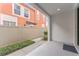 Relaxing outdoor patio space with privacy fence, walkway, and lush landscaping at 412 S Albany Ave # 2, Tampa, FL 33606
