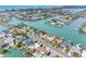 Aerial view features a property with waterfront access, lush landscaping, and easy access to coastal amenities at 440 115Th Ave, Treasure Island, FL 33706