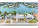 Waterfront homes boast stunning canal access with private docks, complemented by lush tropical landscaping and boat access at 440 115Th Ave, Treasure Island, FL 33706
