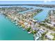 Beautiful aerial view of the property surrounded by lush landscaping, waterfront access, and serene community at 440 115Th Ave, Treasure Island, FL 33706