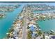 Gorgeous aerial view of a waterfront community, showcasing lush landscapes, boat docks, and picturesque homes at 440 115Th Ave, Treasure Island, FL 33706