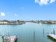 Expansive waterfront view showcases a serene waterway, docks, and beautiful homes under a bright blue sky at 440 115Th Ave, Treasure Island, FL 33706