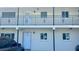 Apartment building exterior, showcasing the entrance to unit 167, with a tidy and accessible facade at 4560 Overlook Ne Dr # 167, St Petersburg, FL 33703