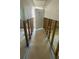 Hallway with exposed framing and unfinished walls leading to a doorway, showing renovation progress at 4560 Overlook Ne Dr # 167, St Petersburg, FL 33703