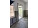Interior door and window surrounded by unfinished walls, highlighting a possible renovation project at 4560 Overlook Ne Dr # 167, St Petersburg, FL 33703