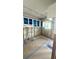 Bright kitchen awaiting remodel with stylish blue-accented cabinets and contemporary track lighting at 4560 Overlook Ne Dr # 167, St Petersburg, FL 33703