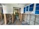 Kitchen under construction with exposed framing and blue cabinets, ideal for a modern design renovation at 4560 Overlook Ne Dr # 167, St Petersburg, FL 33703