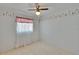 Bedroom featuring light colored walls and flooring, a window, a ceiling fan and decor at 508 E Brentridge, Brandon, FL 33511
