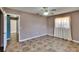 Bedroom with tile floors, ceiling fan and doorway leading to other areas of the home at 508 E Brentridge, Brandon, FL 33511